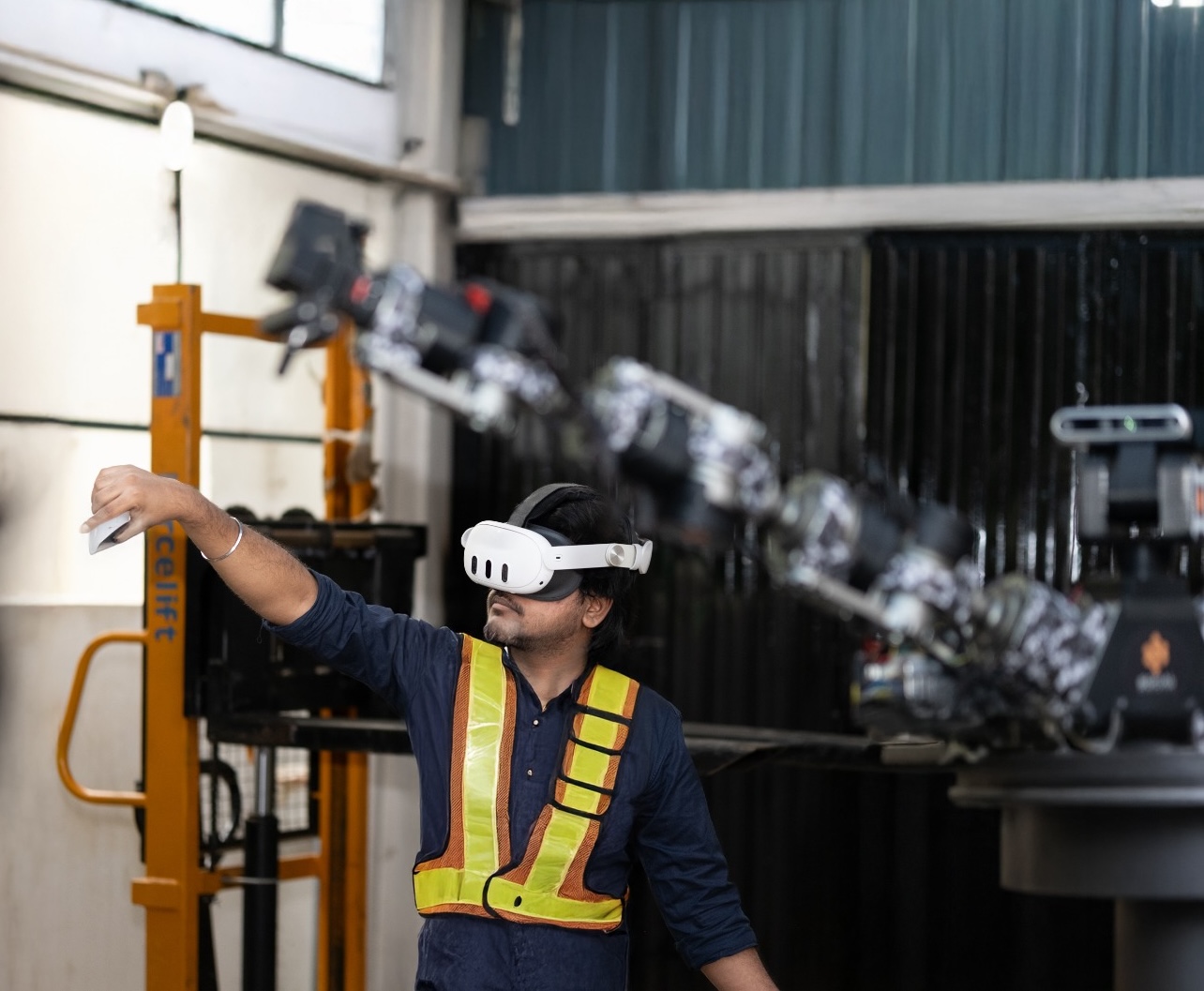 Worker utilizing VR technology in an industrial setting